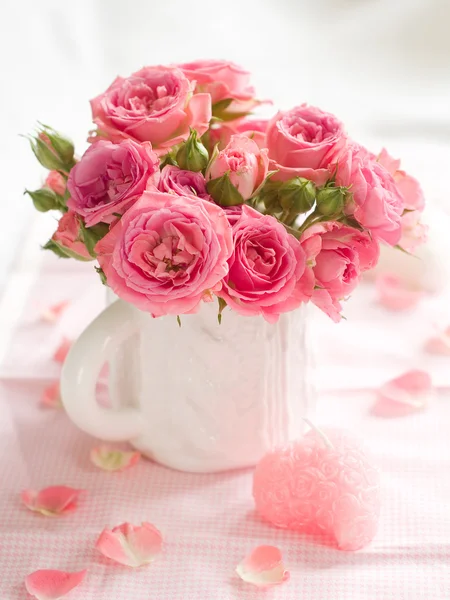 Pink roses with candle — Stock Photo, Image