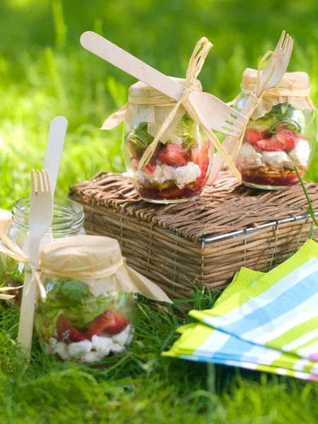 Jars with strawberries, cream and mint — Stock Photo, Image