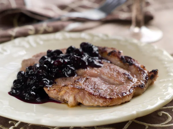 Steak with prune sauce — Stock Photo, Image