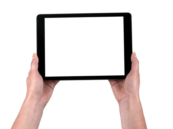 Tableta sostenida en las manos de las mujeres sobre un fondo blanco —  Fotos de Stock