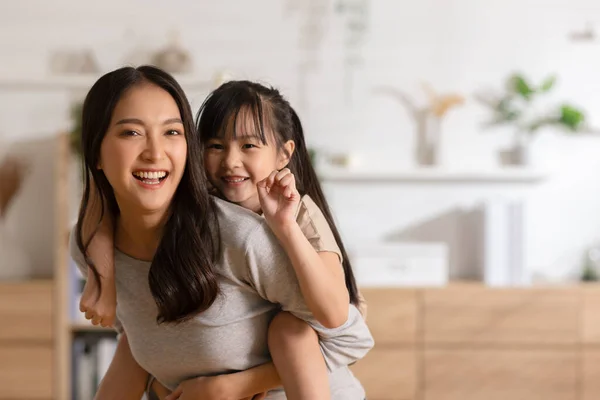 Happy Asian Mom Holding Her Daughter Playing Together Home Little — Stok Foto
