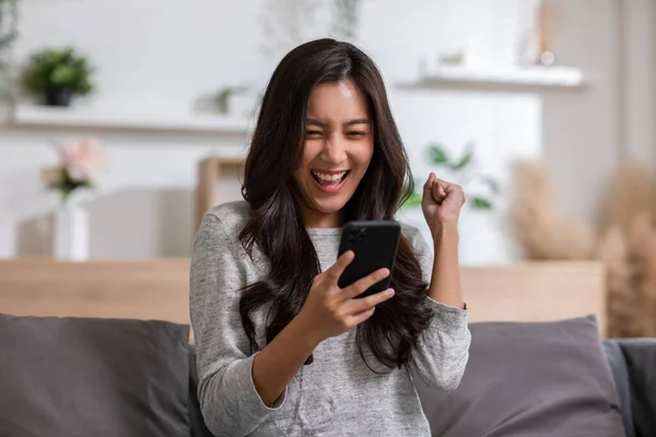 Millennial Asian Young Woman Looking Mobile Phone Laughing Good News — ストック写真