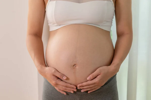 Close Pregnant Woman Standing Front Windows Stroking Her Big Belly — Stockfoto