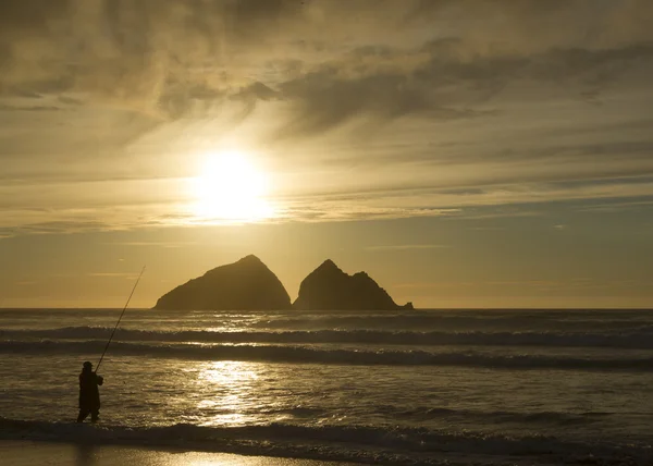 Fisherman silhouette at sunset — Stock Photo, Image