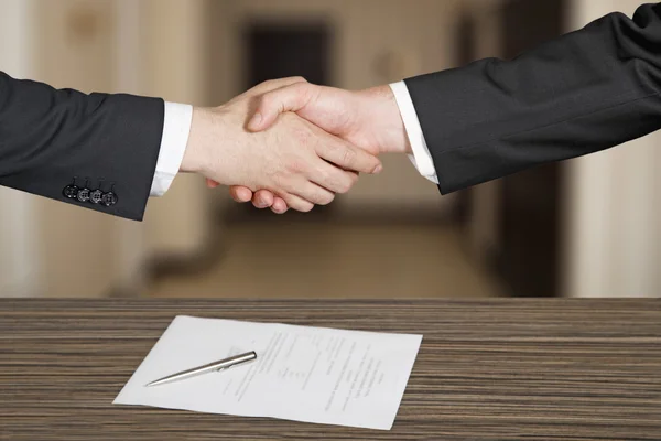 Business handshaking in office Stock Image