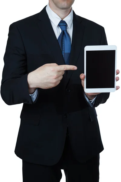 Empresário segurando um tablet de computador e apontando para ele — Fotografia de Stock