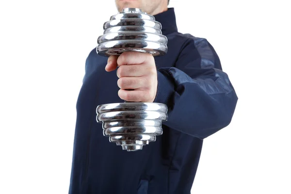 Athlete holding a dumbbell in front of him — Stock Photo, Image