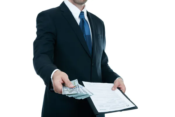 Бизнесмен дает деньги на контракт на белом фоне Стоковое Изображение