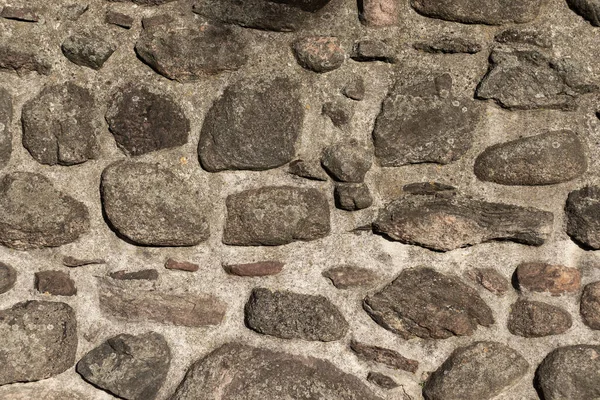 Stenvägg med sällsynta stora stenar. Texturer som bakgrund — Stockfoto