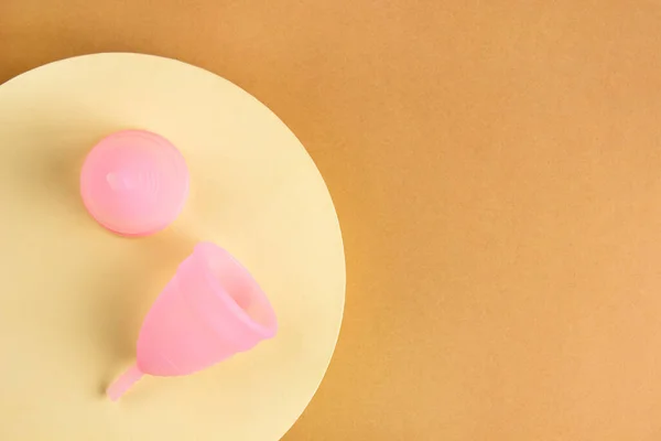 Two Pink Menstrual Cups Made Medical Silicone Lie Light Yellow — Stockfoto