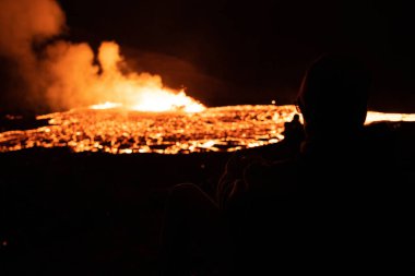 Hikers watching the Meradalir Eruption of Fagradalsfjall Volcano in Iceland 2022. High quality. Icelands newest eruption of the Fagradalsfjall volcano with hundreds of spectators