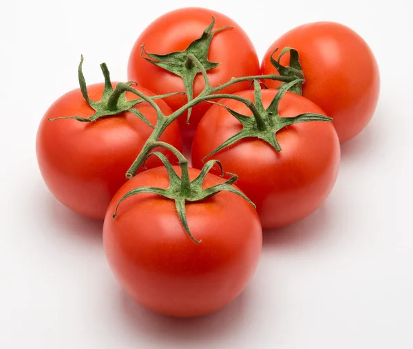 Fünf Tomaten Stockfoto