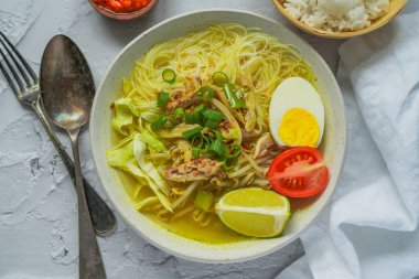 Soto is a traditional Indonesian soup mainly composed of broth, chicken and vegetables.