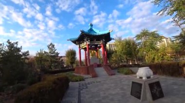 rotating Buddhist drums and Buddha statue