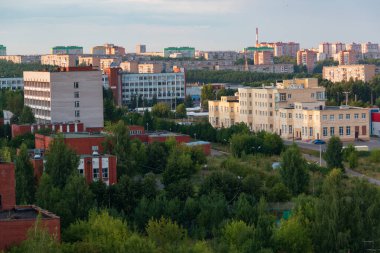 provincial city of Russia with high-rise buildings in the evening