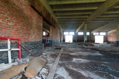 large abandoned warehouse with brick walls