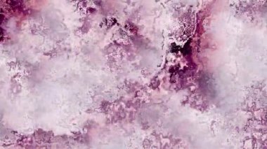 Ayrıntılı parçacık dokusunu canlı renklerle değiştiren 4k arkaplan videosu