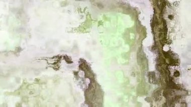 Ayrıntılı parçacık dokusunu canlı renklerle değiştiren 4k arkaplan videosu