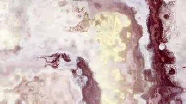 Ayrıntılı parçacık dokusunu canlı renklerle değiştiren 4k arkaplan videosu