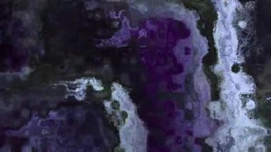 Ayrıntılı parçacık dokusunu canlı renklerle değiştiren 4k arkaplan videosu