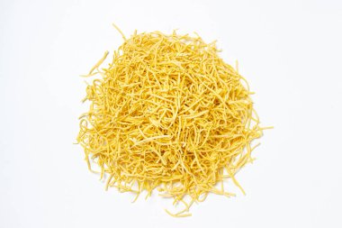 Egg noodles on a white background. Isolated dry homemade noodles. Traditional pasta