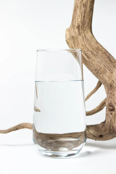 Glass Clean Drinking Water White Background Dry Branch Next Glass — ストック写真