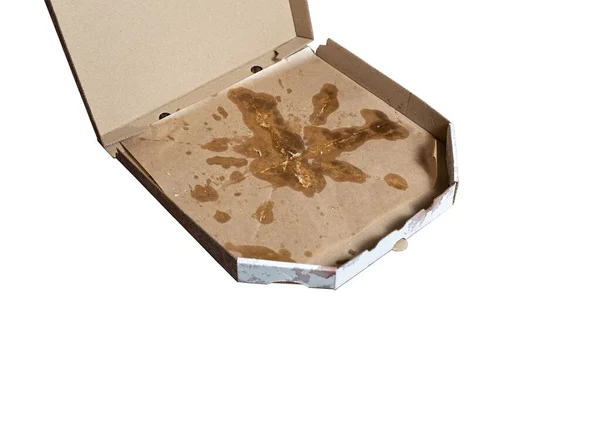 Sağlıksız gıda konsepti. Kirli pizza kutusu beyaza izole edilmiş. Boş mukavva pizza kutusu. Yağlı yemek..