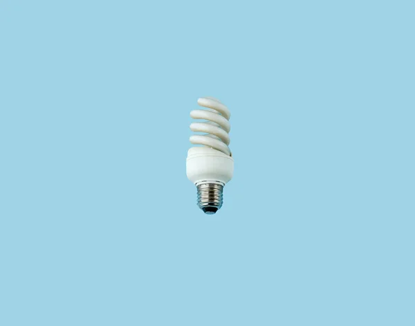 Concept Energy Conservation Fluorescent Lightbulbs Isolated Blue Background — Stock Photo, Image