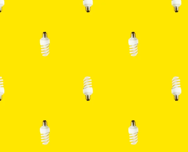 Conceito Economia Energia Padrão Sem Costura Lâmpadas Fluorescentes Fundo Amarelo — Fotografia de Stock