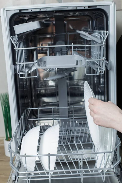 Girl Takes Out Clean Plate Dishwasher — Fotografia de Stock