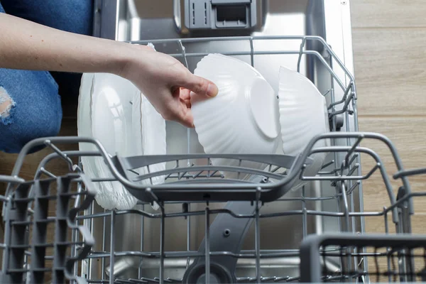 Girl Takes Out Clean Plate Dishwasher — Fotografia de Stock