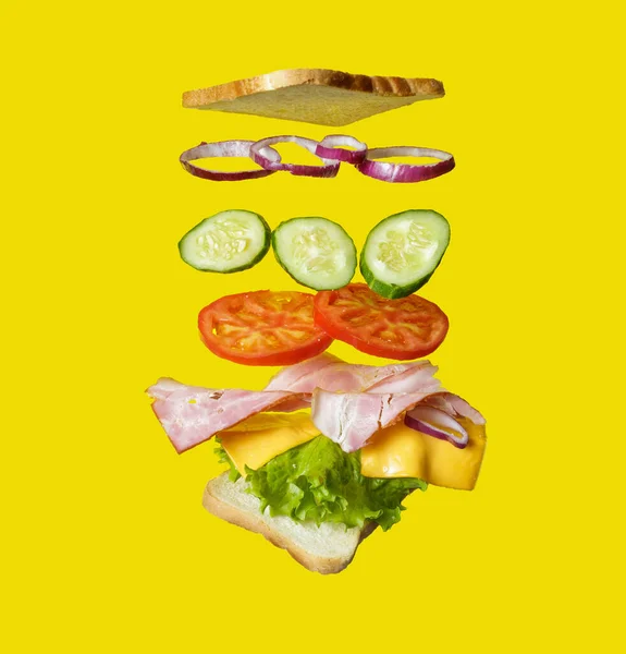 Flying Sandwich Bread Ham Tomato Onion Salad Isolated Yellow — Fotografie, imagine de stoc