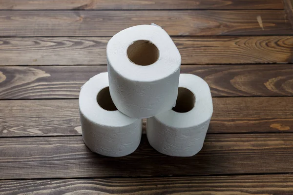 Slide Toilet Paper Rolls Wooden Background — Φωτογραφία Αρχείου