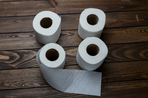 Four Rolls Toilet Paper Wooden Background — Foto de Stock