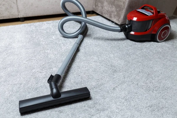 vacuum cleaner on the carpet. House cleaning.
