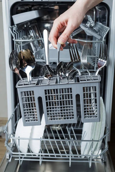 Woman Hand Loads Basket Forks Spoons Dishwasher Washing Dishes Maintaining — Stock Photo, Image