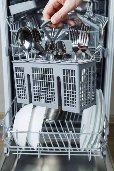 Woman Hand Loads Basket Forks Spoons Dishwasher Washing Dishes Maintaining — Stock Photo, Image