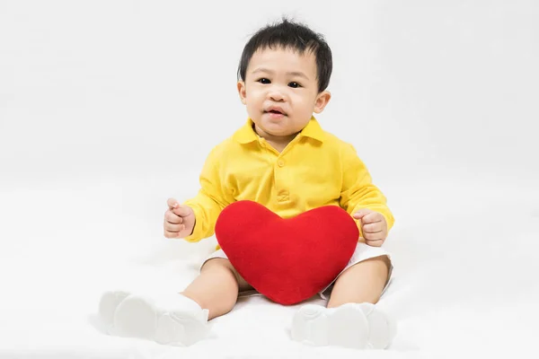 Asiatischer Süßer Junge Von Etwa Einem Jahr Gelbem Hemd Sitzend Stockbild