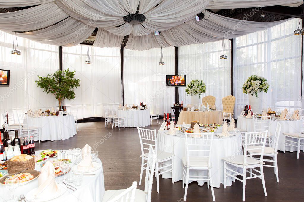 Indoor room with tables for a banquet or wedding