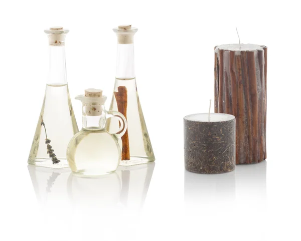 Spa oils in bottles and scented candles. With PS paths. — Stock Photo, Image