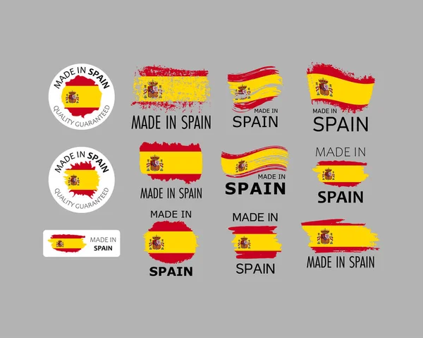 Set of stickers. Made in Spain. Brush strokes shaped with Spanish flag. Factory, manufacturing and production country concept. Design element for label and packaging. Vector colorful illustration.