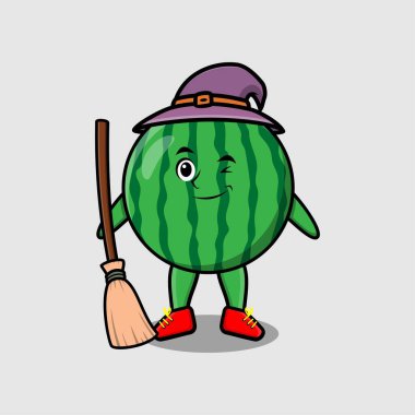 Şapkası ve süpürgesi olan karpuz şeklinde şirin bir cadı.