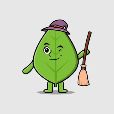 Yeşil yaprak şeklinde, şapkası ve süpürgesi olan sevimli bir cadı çizgi filmi.