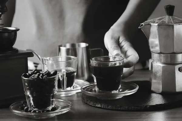 Coffee and coffee equipment on the table.Black and white photo