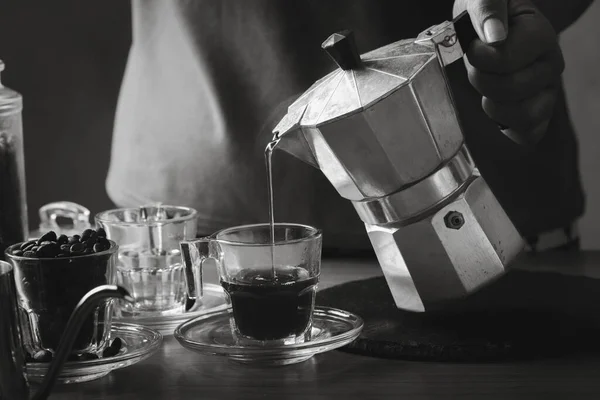 Coffee and coffee equipment on the table.Black and white photo