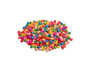 Assorted colored plastic beads on a white background.