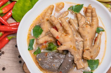 Spicy Stewed Chicken Feet Tom Yum with Fresh Chili, Lemongrass, Kaffir Lime Leaves