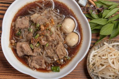 Braised pork noodles with vegetables.and pork balls with soup Thai food