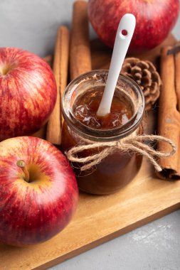 Apple jam in a transparent glass jar