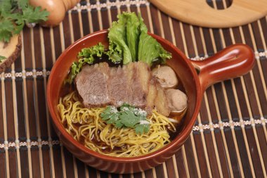 Braised beef egg noodles with meatballs. Popular street food, Thai food.